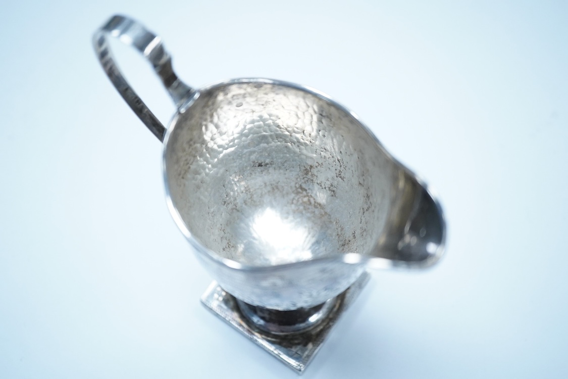 A George III silver helmet shaped cream jug, by Stephen Adams II, London, 1799, 12.8cm, 87 grams.